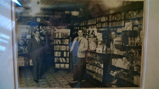 A framed photograph depicts the pharmacy as it was more than 60 years ago. Not much has changed inside the space since then.  